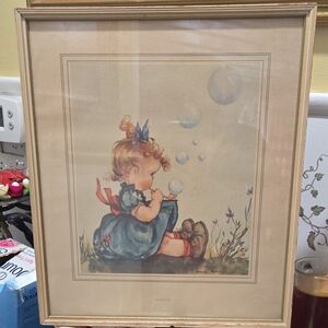 Vintage Framed Print of Girl Blowing Bubbles